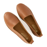 Pair of brown flat shoes on a white background
