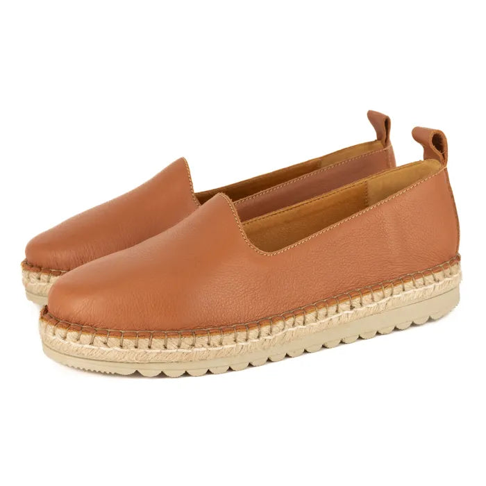 Pair of brown espadrille shoes on a white background