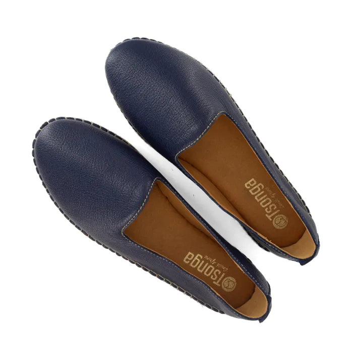 Pair of navy blue loafers with brown soles on a white background