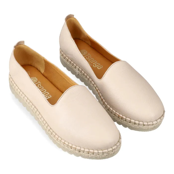 Pair of beige espadrilles on a white background