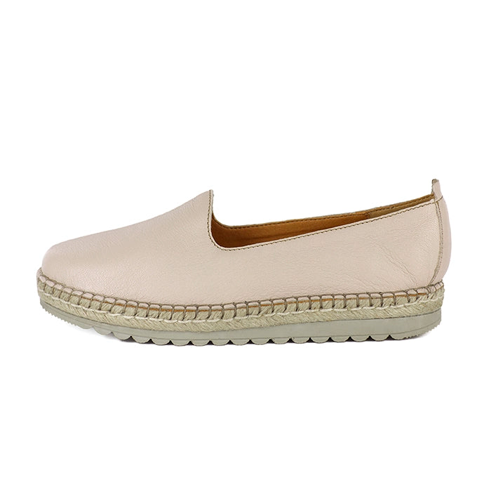 Beige espadrille shoe on a white background