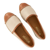 Pair of beige and brown loafers with 'Tsonga' branding on a white background