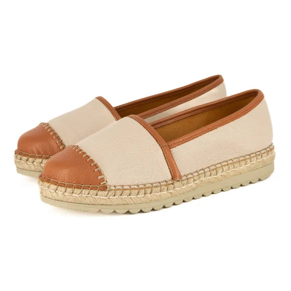 Pair of beige and brown espadrilles on a white background