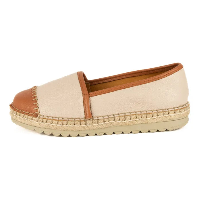 Beige espadrille shoe with brown accents on a white background