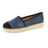 Navy blue espadrille shoe with off white sole on a white background