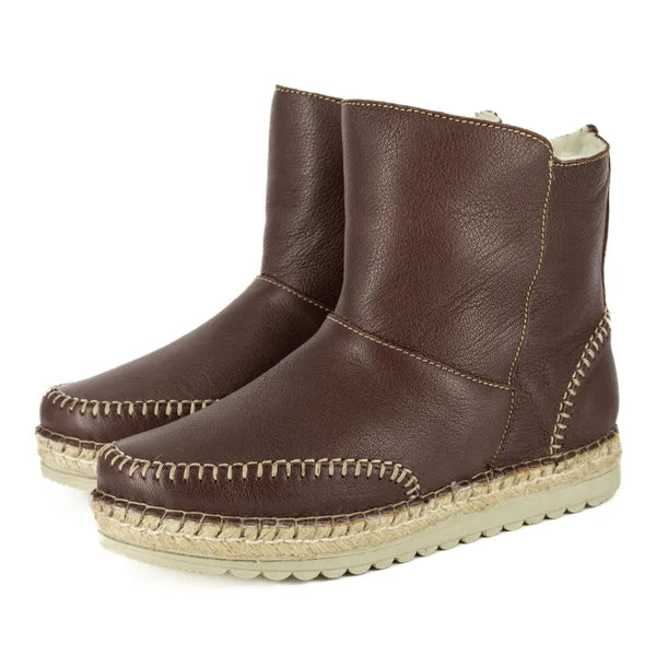 Pair of brown leather espadrille boots on a white background