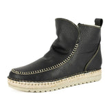 Black leather espadrille boot with beige sole on a white background