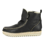 Black leather espadrille shoe with white sole on a white background
