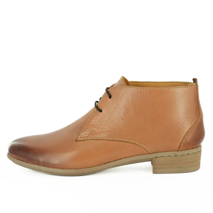 Tan leather ankle boot on a white background