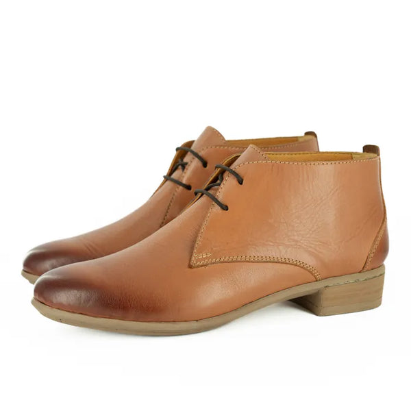 Pair of brown leather boots on a white background