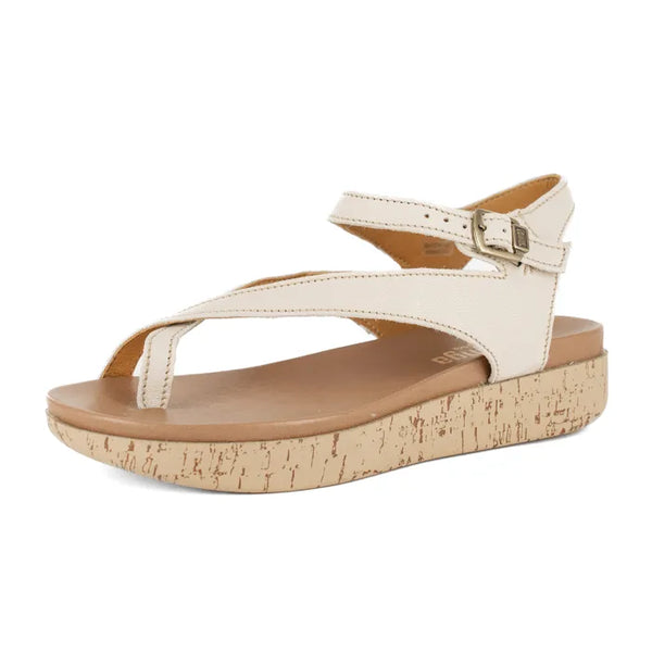 White sandal with cork print sole on a white background