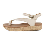 Beige sandal with cork print sole on a white background