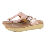 Pink sandals with cork print sole on a white background