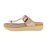 Pink sandal with a beige sole on a white background