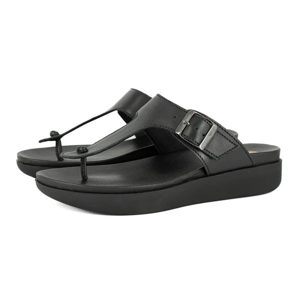 Black sandals with a buckle on a white background