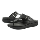 Black sandals with two straps on a white background