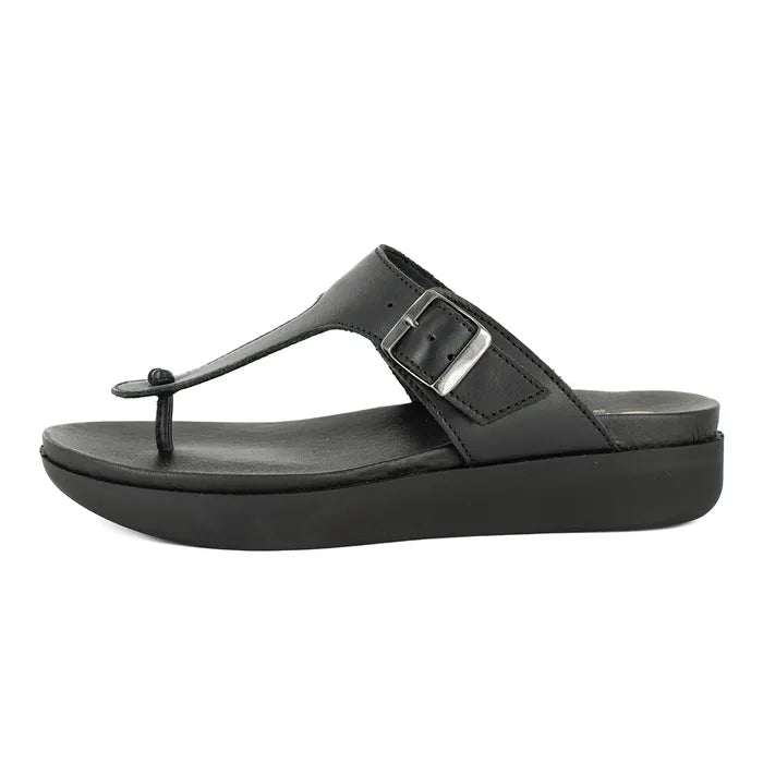 Black sandal with a buckle on a white background