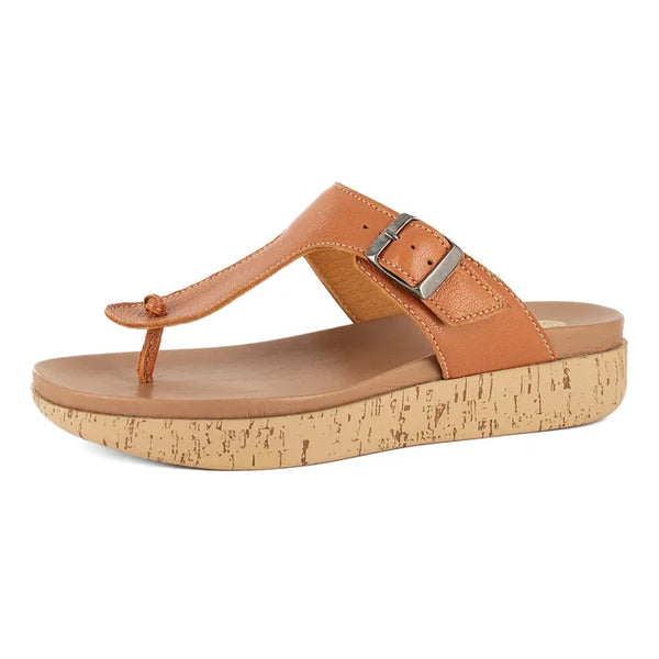 Tan sandal with cork print sole on a white background