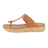 Tan sandal with cork print sole on a white background
