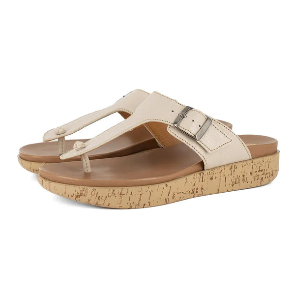 Beige sandals with cork print sole on a white background