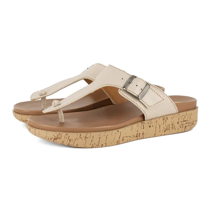 Beige sandals with cork print sole on a white background