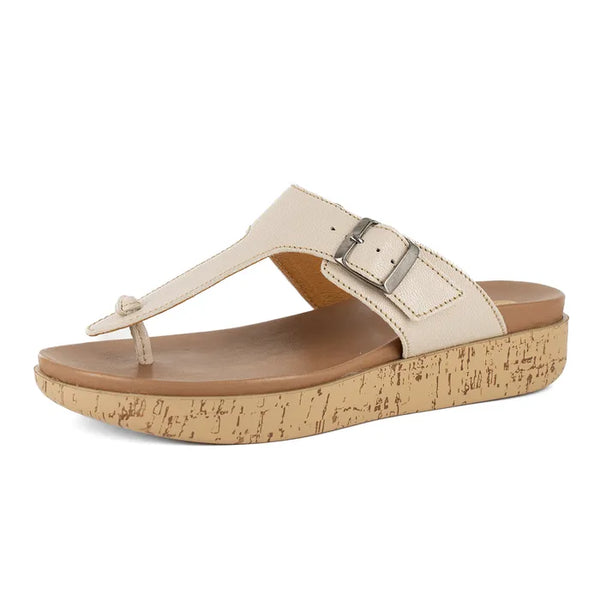 Beige sandal with cork print sole on a white background