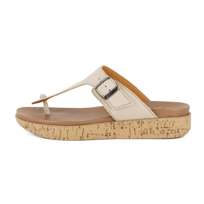 Beige sandal with cork print sole on a white background
