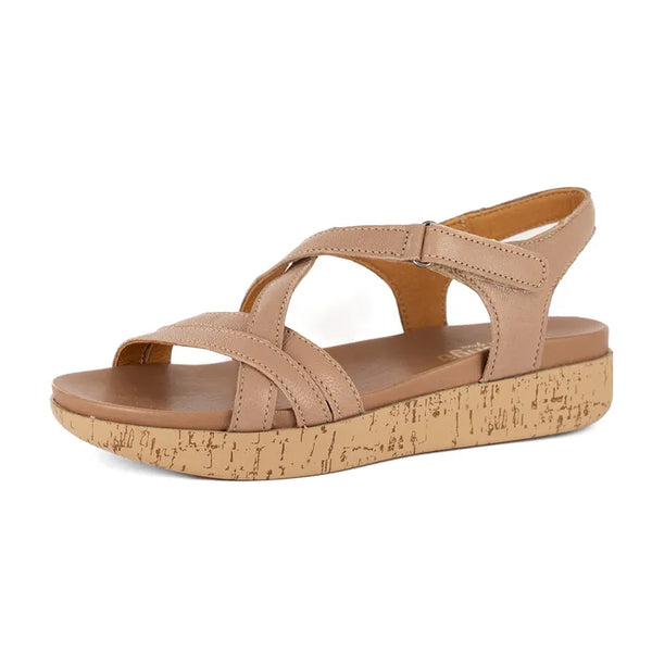 Beige sandal with cork print sole on a white background