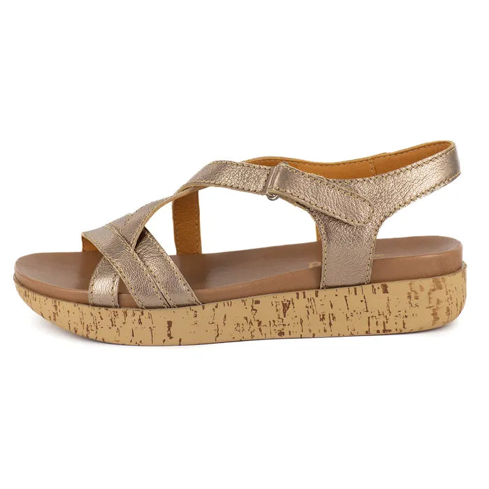 Gold sandal with cork print sole on a white background