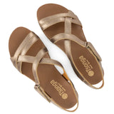 Pair of gold sandals with 'Tsonga' branding on a white background