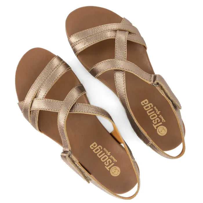 Pair of gold sandals with 'Tsonga' branding on a white background