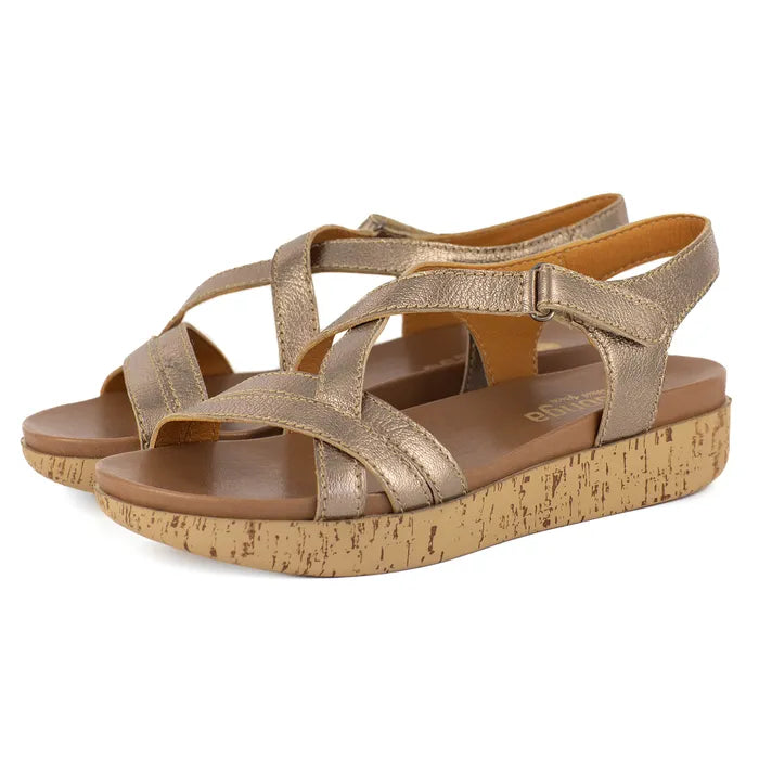 Gold sandals with cork print platform on a white background