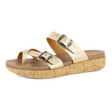 Gold sandal with cork print platform on a white background