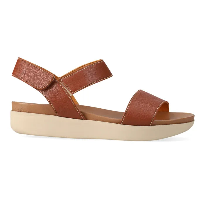 Brown sandal with multiple straps on a platform sole on a white background