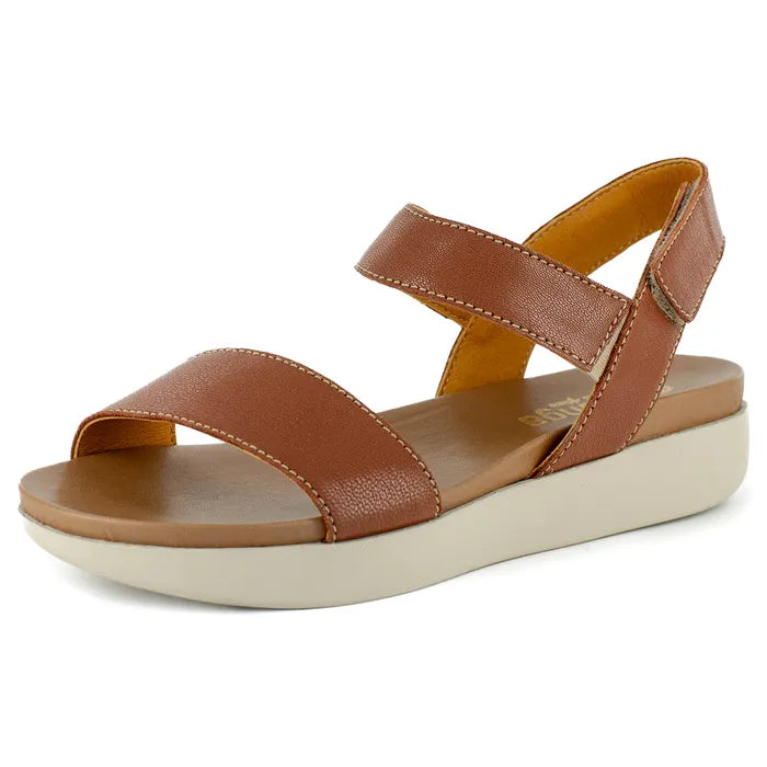 Brown sandal with a off-white sole on a white background