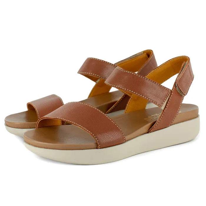Brown sandals with off-white soles on a white background