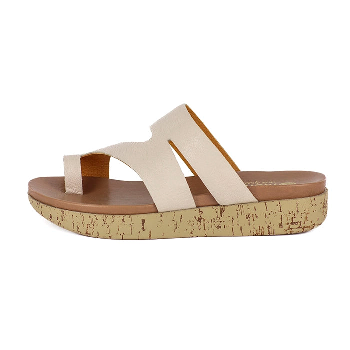 Beige sandal with cork sole on a white background