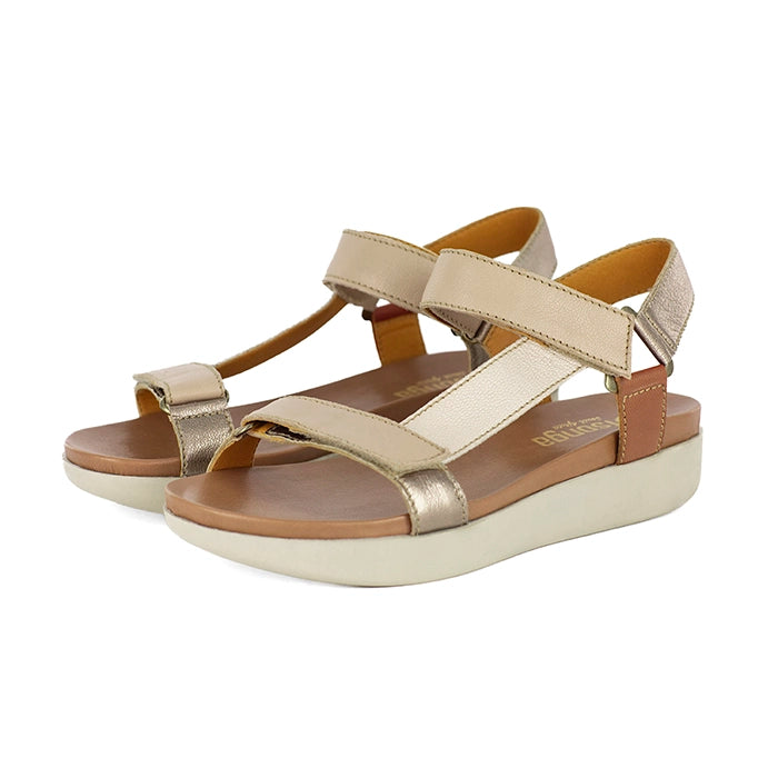 Pair of beige sandals with brown accents on a white background