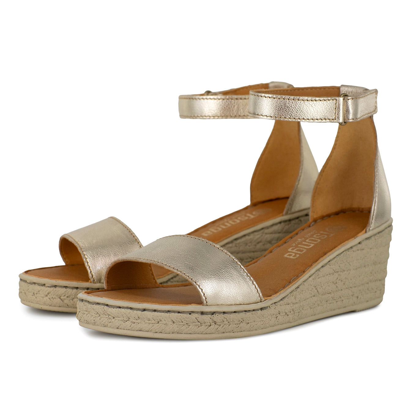 Gold wedge sandals with beige sole on a white background