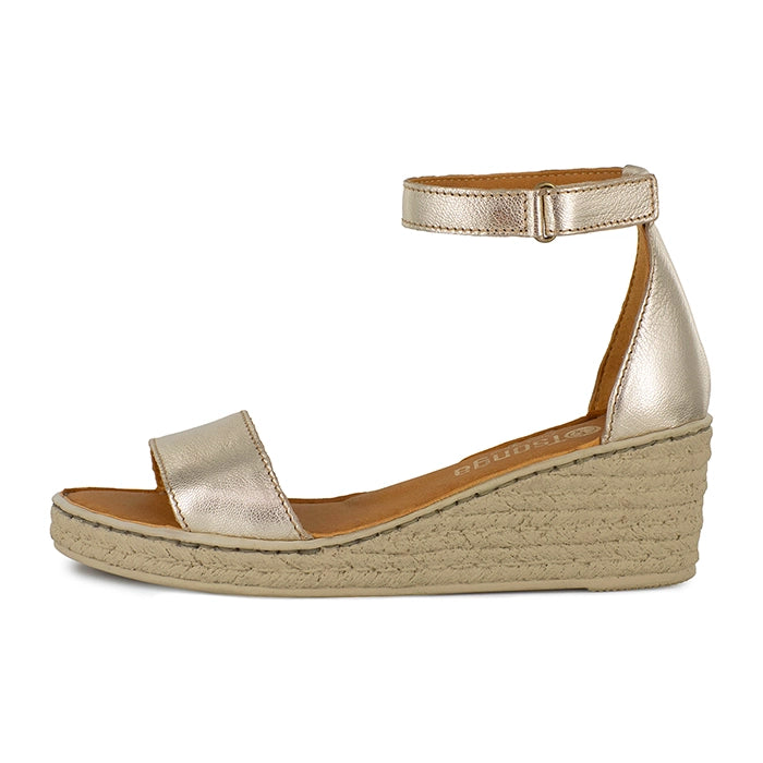 Gold wedge sandal with beige sole on a white background