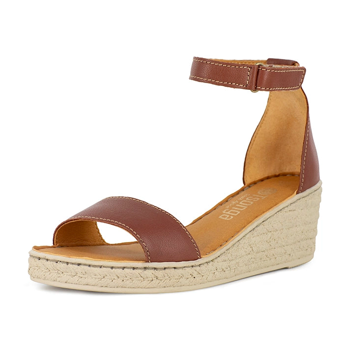 Brown wedge sandal with beige sole on a white background