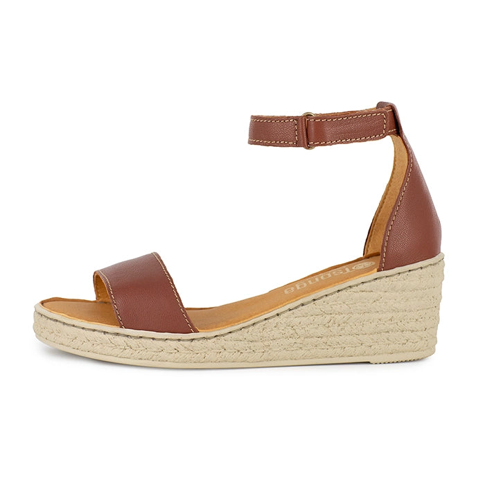 Brown wedge sandal with beige sole on a white background