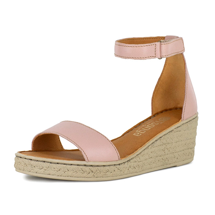 Pink wedge sandal with beige sole on a white background