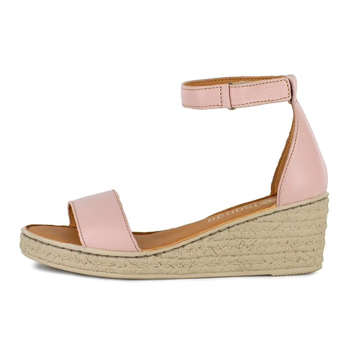 Pink wedge sandal with beige sole on a white background