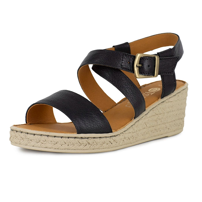 Black wedge sandal with a beige sole on a white background
