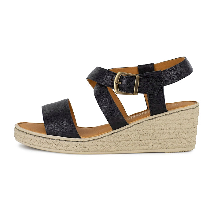 Black wedge sandal with beige sole on a white background