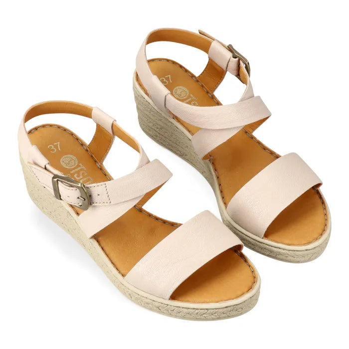 Pair of beige sandals with espadrille print sole on a white background