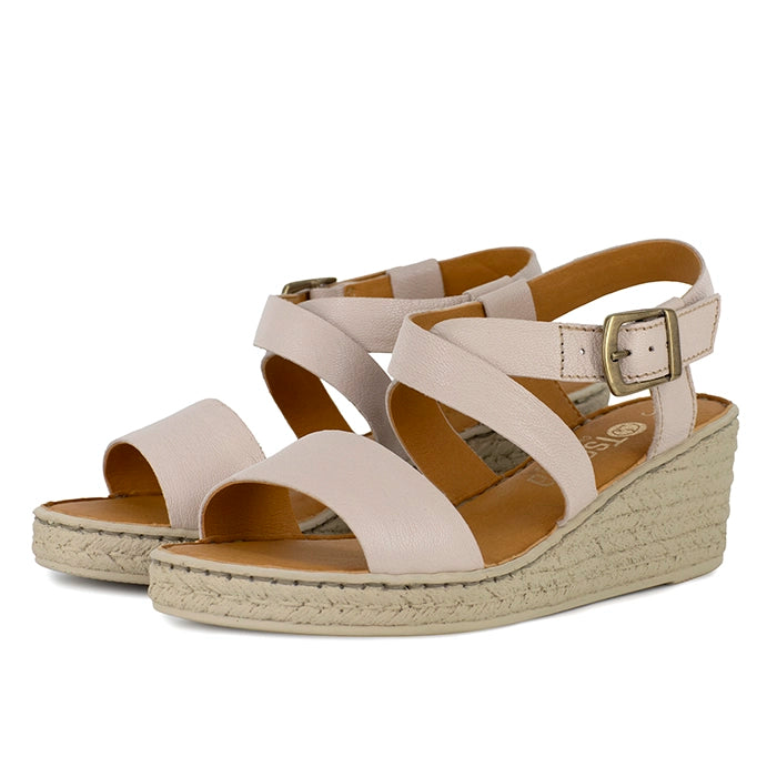 Beige wedge sandals with beige sole on a white background