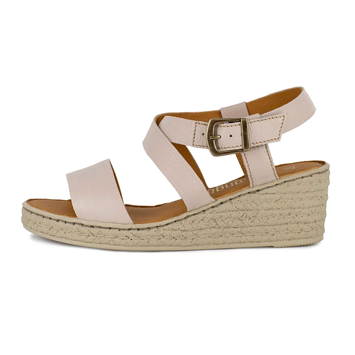 Beige wedge sandal with beige sole on a white background