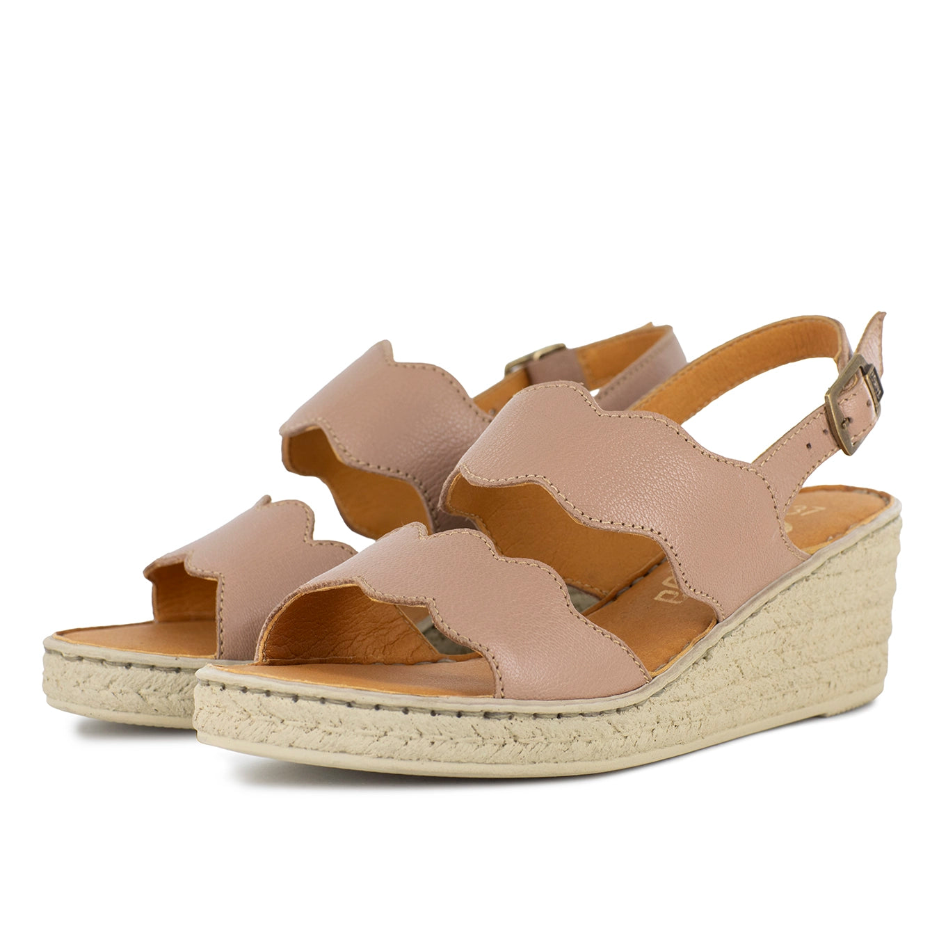 Beige wedge sandals on a white background